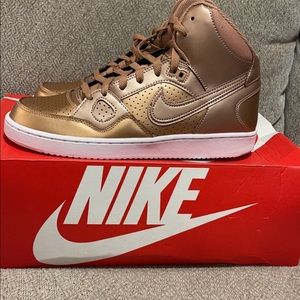 Brand new Nikes, size 9.5 color bronze